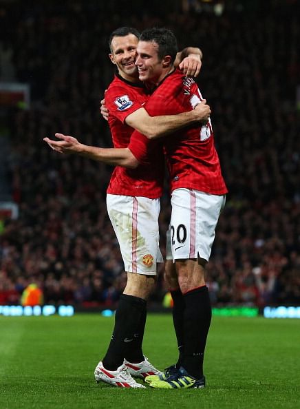 Robin van Persie of Manchester United celebrates scoring his hat trick goal with Ryan Giggs during the Barclays Premier League match between Manchester United and Aston Villa at Old Trafford on April 22, 2013 in Manchester, England. (Photo by Alex Livesey/Getty Images)
